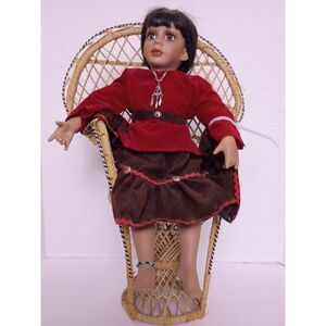 Native American Navajo Porcelain Doll Sitting in Miniature Wicker Peacock Chair